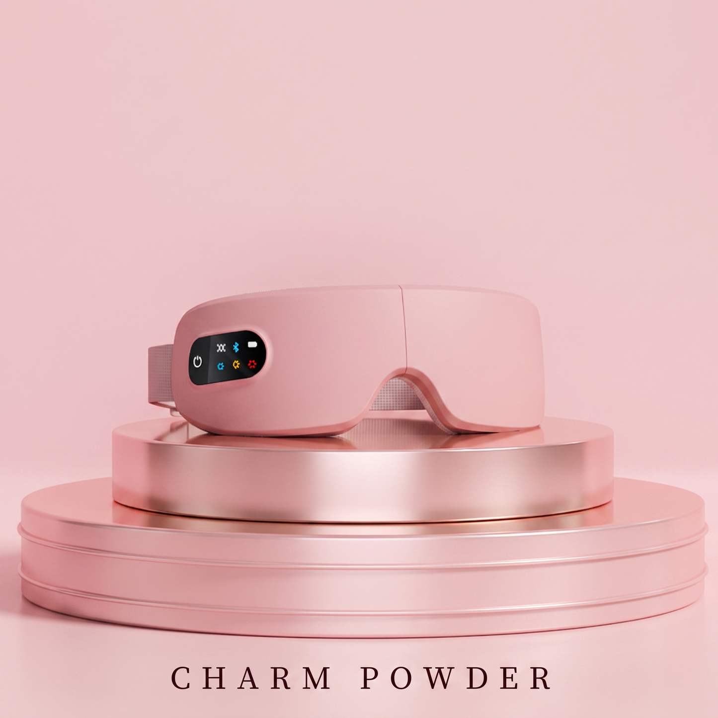 SOLACE eye massager in Charm Powder pink on a pink pedestal — premium studio shot